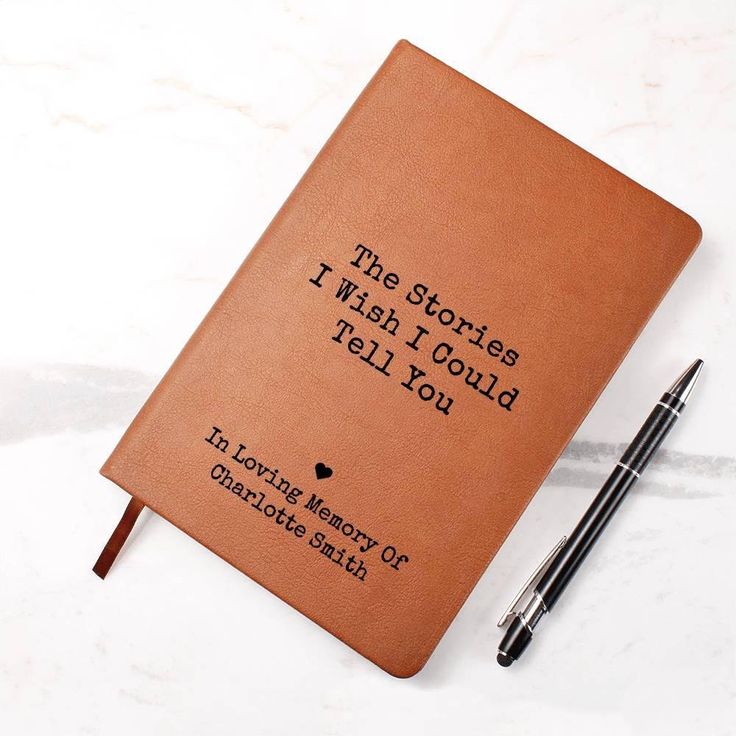 a brown notebook with writing on it and a pen next to it that says, the stories i wish i could tell you