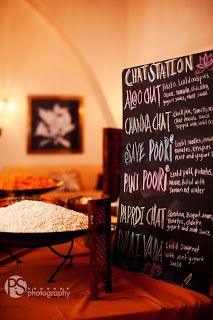 a chalkboard sign sitting on top of a table