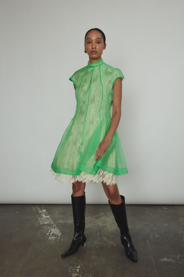 Designer Fitted Mini Dress With Short Sleeves, Designer Silk Green Dresses, Designer Fitted Sleeveless Dress, Designer Fitted Sleeveless Mini Dress, Designer Fitted Mini Dress, Designer Green Spring Dress, Designer Sleeveless Cocktail Dress, Green Silk Knee-length Dress, Green Knee-length Silk Dress