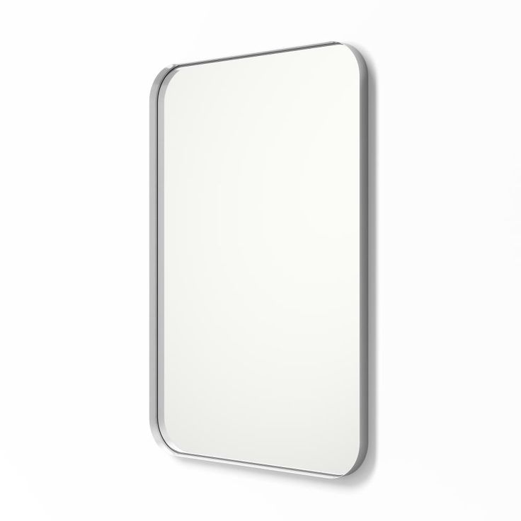 a white mirror hanging on the wall