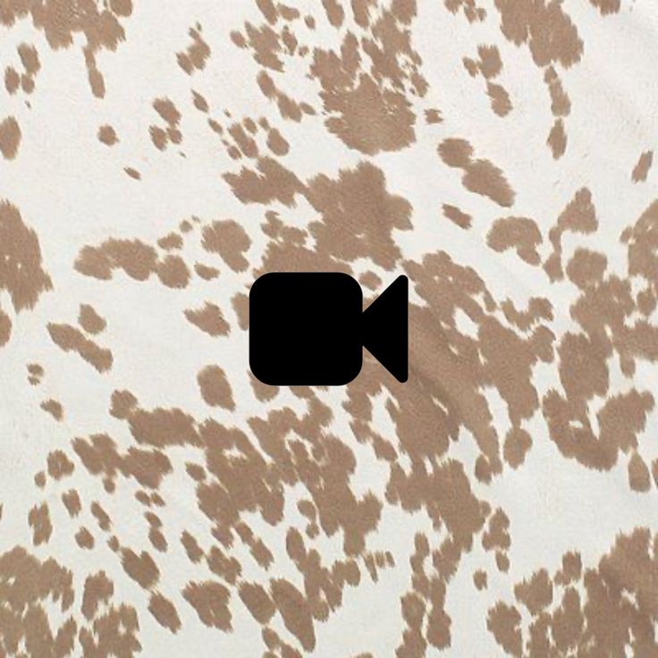 an animal print wallpaper with a black square in the center and brown spots on it