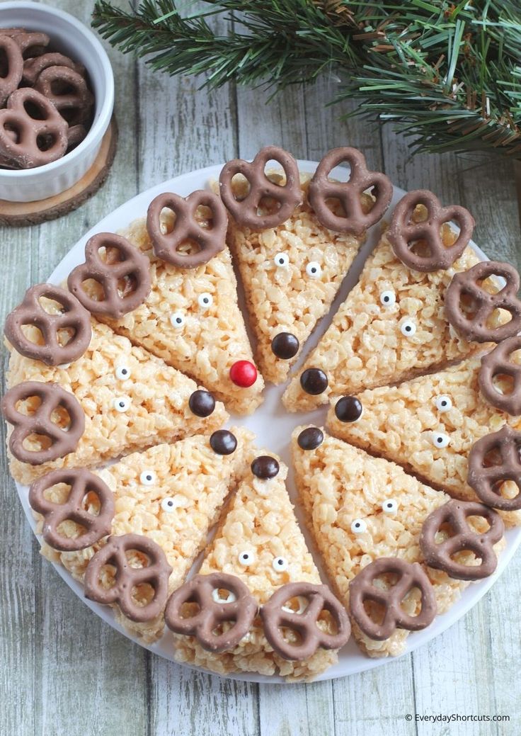 rice krispie reindeers on a plate with pretzels