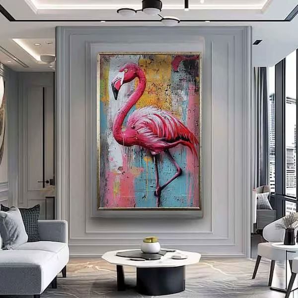 a living room filled with furniture and a pink flamingo painting on the wall next to a white couch