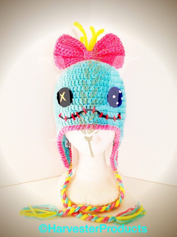 a crocheted hat with ears and big eyes