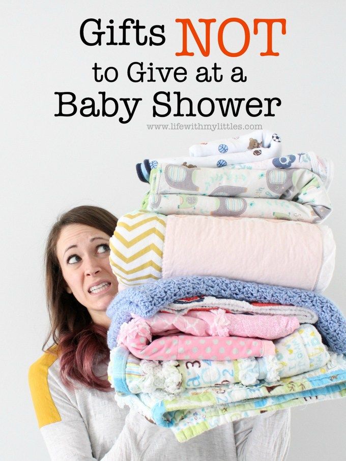 a woman holding a stack of baby blankets with the words gifts not to give at a baby shower