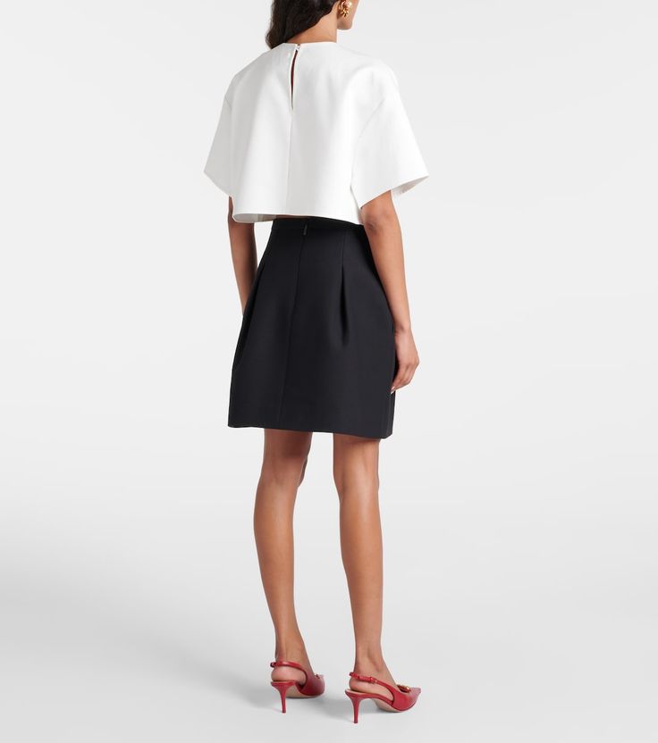 Crepe Couture miniskirt in black - Valentino | Mytheresa Elegant A-line Mini Skirt For Evening, Formal Mini Pleated Skort, Formal Mini Length Pleated Skort, Elegant A-line Skort For Work, Elegant A-line Skort For Workwear, Formal Mini Skirt For Summer, Elegant Evening A-line Mini Skirt, Chic A-line Silk Skirt, Chic Silk Office Skirt