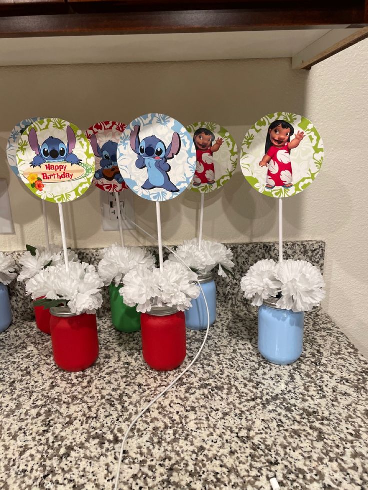 there are some decorations on top of the cupcakes in this kitchen countertop