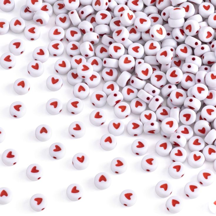 many white and red hearts are scattered together