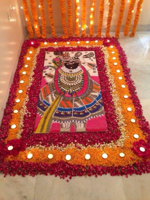 a decorated chair with candles on the floor