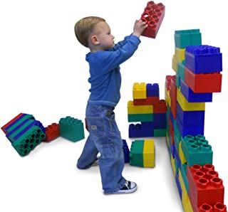 a young boy playing with blocks and toys