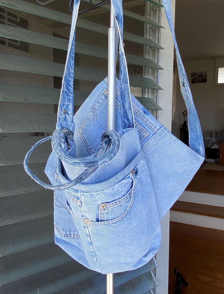 This bag is made from recycled denim and recycled kimono fabric. You can use it whenever you want for shopping, work, school or outings. A size bag: length 29cm x width 35cm Handle: 36cm Strap: 94cm 2 magnetic hooks The pocket is on one side of the front, there is no pocket inside.        B size bag: 28cm long x 35cm wide Strap 92cm 2 magnetic hooks There are pockets on both sides of the front, but no inside. We recommend hand washing. Everyday Recycled Denim Shoulder Bag, Upcycled, Daily Use Upcycled Denim Shoulder Bag, Upcycled Denim Hobo Bag, Upcycled Recycled Denim Tote Shoulder Bag, Upcycled Denim Tote Shoulder Bag, Trendy Upcycled Tote Bag, Trendy Recycled Denim Bags For Daily Use, Denim Travel Bag With Upcycled Material, Upcycled Shoulder Bag In Recycled Denim