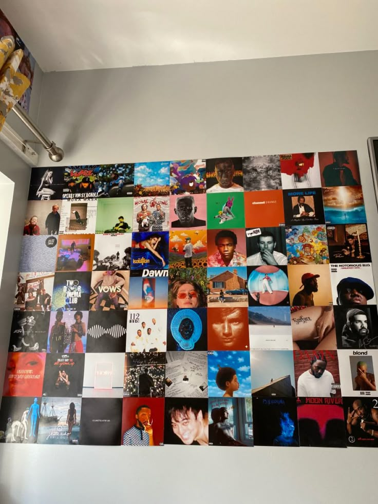 the wall is covered with many different pictures