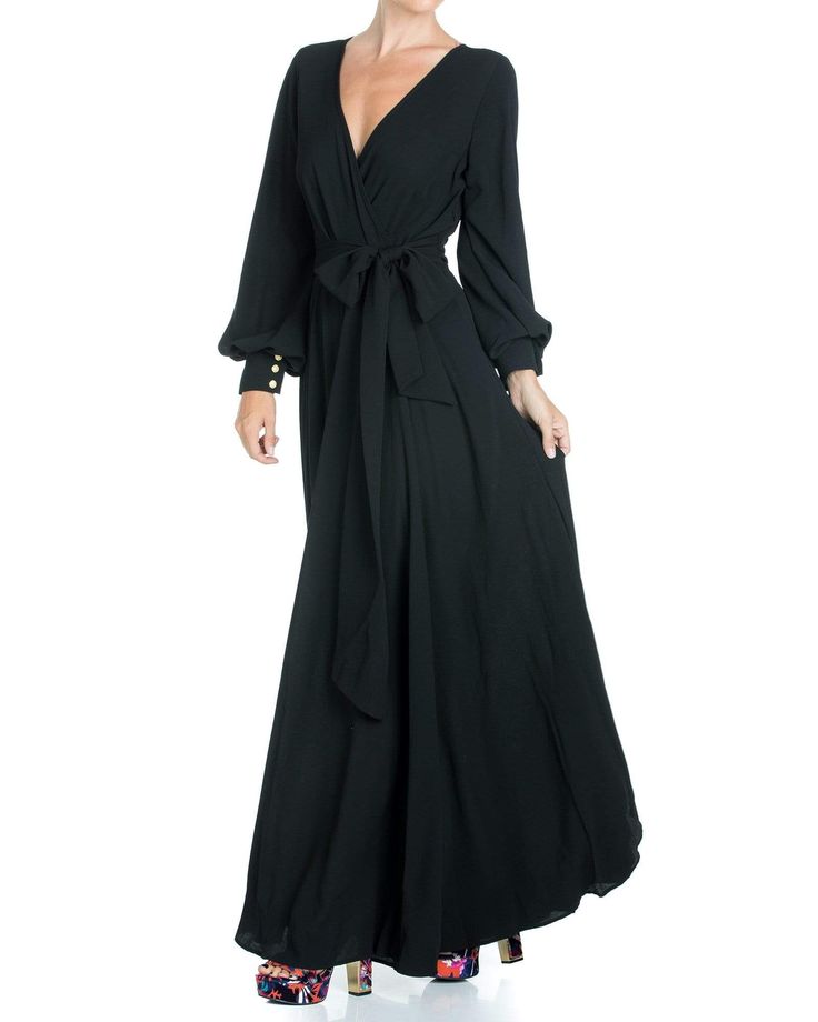 This 70's inspired maxi dress features a sexy cross front V-shaped surplice neckline. The elasticized waist adjusts to fit a range of sizes and has an attached self-tying belt at the right-hand side seam. The cuffed bell sleeves add a hint of retro glamour. The opaque fabric has a butter-soft hand with gorgeous, vibrant hues. The full, sweeping circle mid-length skirt is perfect for making a dramatic entrance to any event. The skirt is partially lined. ** Based on the settings of your display, c Circle Maxi Skirt, Retro Glamour, Fashion District, Surplice Neckline, Medium Dress, Mid Length Skirts, 70s Inspired, Vintage Glamour, Maxi Wrap Dress