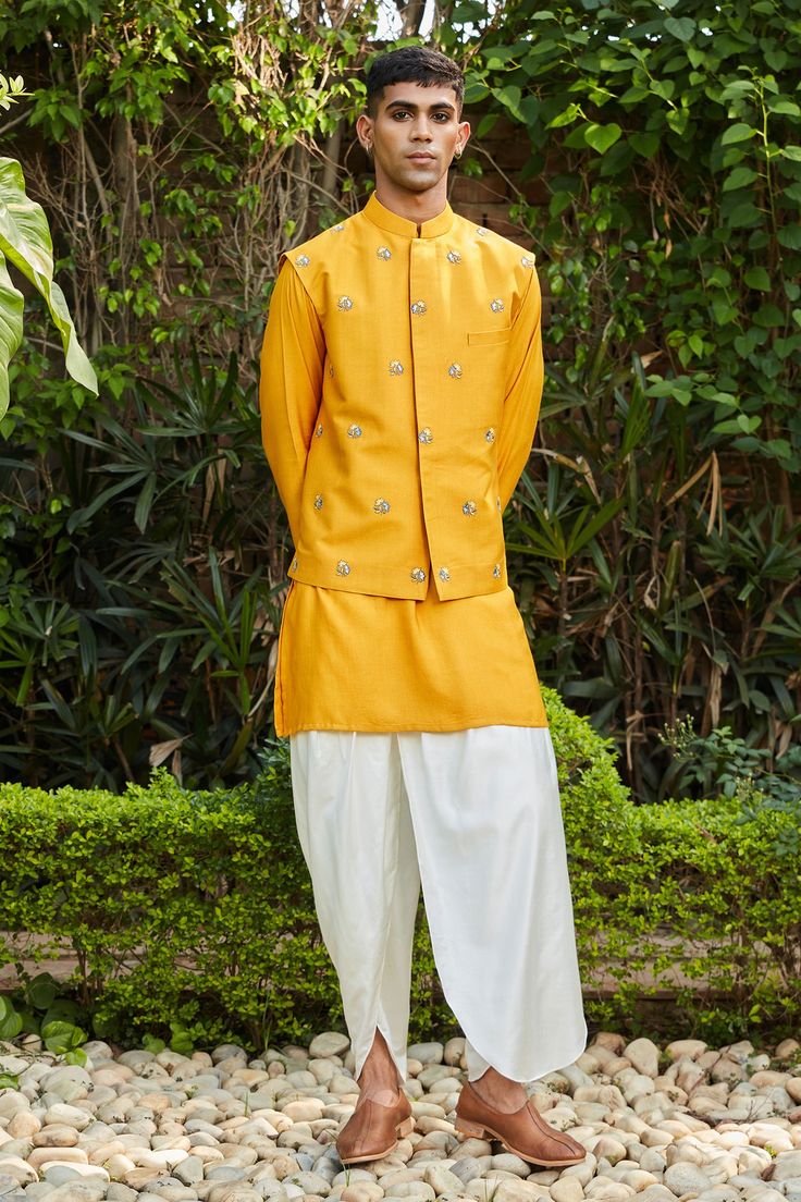 Mustard jacket featuring embroidered floral sprig motifs. Comes with kurta and tulip pant.
Components: 3
Pattern: Embroidered
Type Of Work: Floral
Neckline: Jacket: Mandarin Collar
Sleeve Type: Jacket: Sleeveless, Kurta: Full
Fabric: Cotton Silk Tussar
Color: Yellow
Other Details: 
Straight silhouette
Welt pocket
Closure: Jacket: Front placket
Occasion: Mehendi and Puja,Sangeet - Aza Fashions Mustard Jacket, Tulip Pants, Abstract Embroidery, Nehru Jacket, Nehru Jackets, Indian Fashion Designers, Fashion App, Embroidered Jacket, Kurta Set