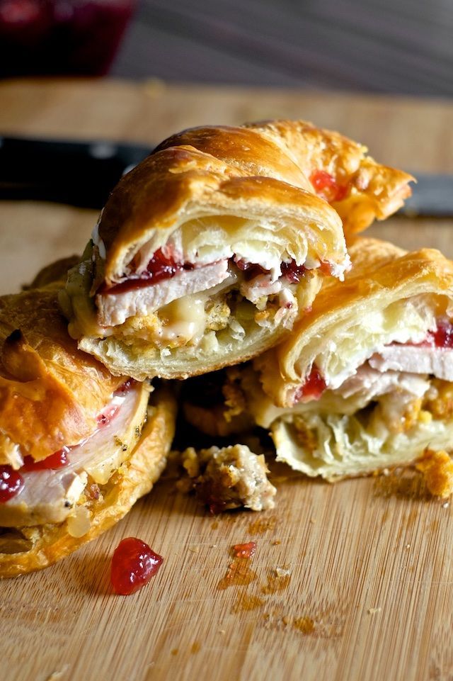 several pastries stacked on top of each other with cranberry sauce in the middle