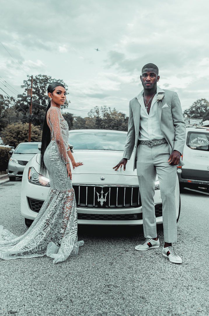 Grey Prom Dress Couple, Prom 2023 Black Couples, Black And Silver Prom Suits For Guys, Silver Suit For Men Prom, Silver Prom Outfits For Couples, Prom Couples Silver, Prom 2k23 Black Couple, Silver And Black Prom Suit, Black Couples Homecoming Outfits