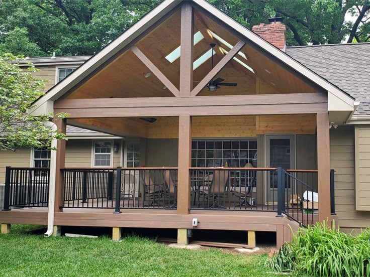 a house with a covered porch in the front yard