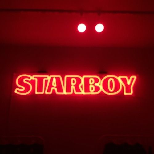 a red neon sign that says starboy on it