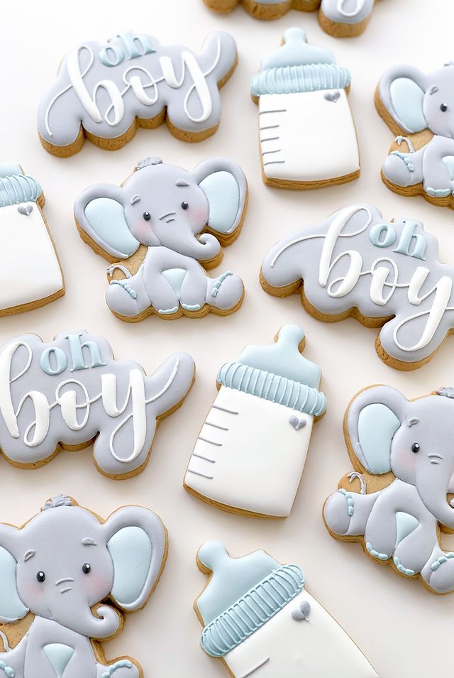 baby shower cookies decorated with royal icing and fondant, including an elephant on top