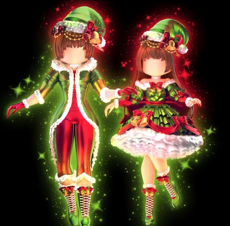 two girls dressed up in christmas clothes and hats, one is holding the other's hand