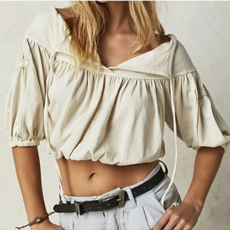 This Free People Top Has A Classic Silhouette With Modern Touches Like A Tie Detail And Pleating For Added Dimension. Perfect For Effortless Style, Its Cropped Fit And Optic White Color Keep You On Trend. Machine Wash Cold 100% Cotton New Without Tags Beige Cotton V-neck Crop Top, Cream Cotton Vacation Tops, Summer Cream Cotton Crop Top, Cream Bohemian Tops For Summer, Cream Cotton Tops For Vacation, Spring Beige Cotton Crop Top, Cream Cotton Crop Top, Beige Cotton Top For Vacation, Bohemian Cream Cotton Top