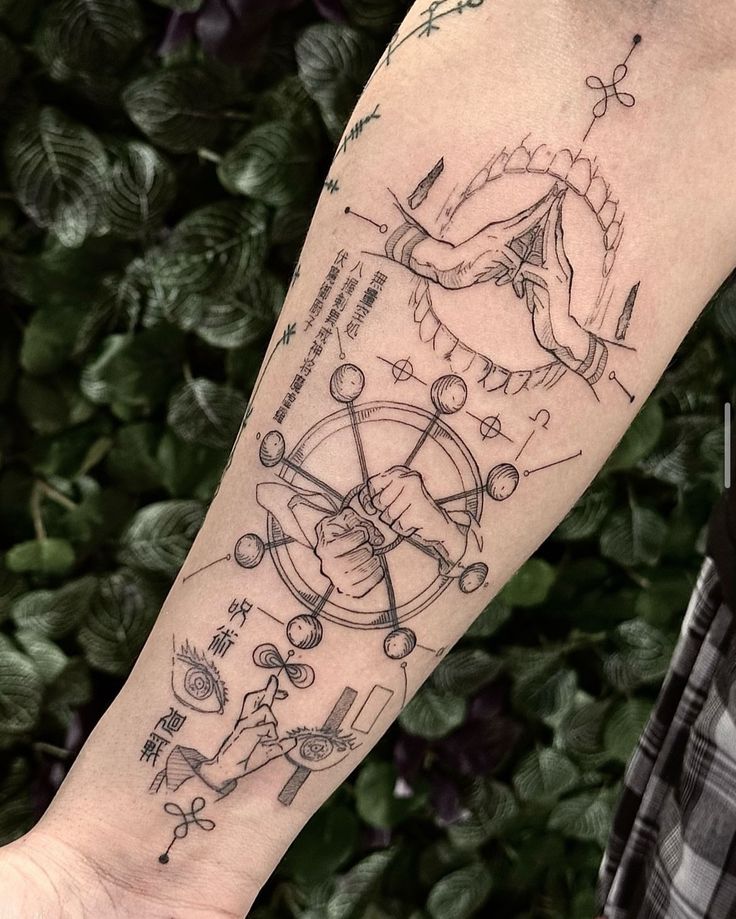 a person with a tattoo on their arm that has various symbols and things in it