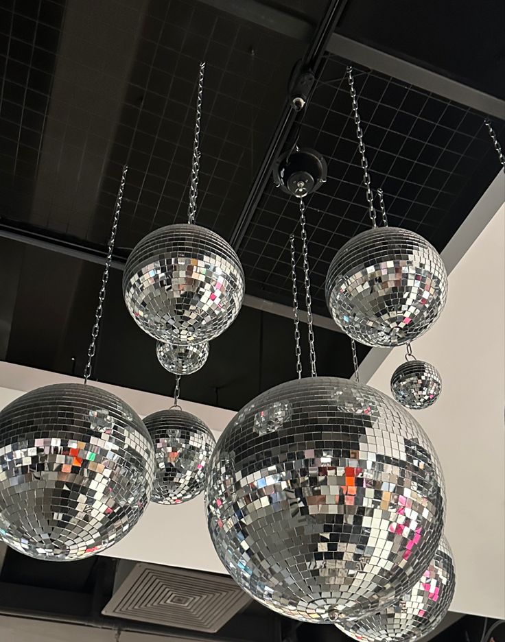 disco ball chandeliers hanging from the ceiling