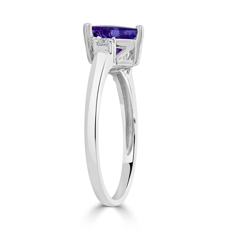 With The Charm Of Trillion Cut Tanzanite And Round Diamonds, This Ring Will Complement All Your Ensembles Effortlessly. Moreover, The Intricate Detailing On 14k White Gold Proves World-class Craftsmanship. Product Information SKU ADG1082/44 Metal Type 14K Metal Color White Gold Ring Style Solitaire Primary Stone Gemstone Name Tanzanite Gemstone Species Zoisite No. Of Gemstones 1 Gemstone Shape Trillion Gemstone Weight 1.08 Gemstone Size 7x7 Origin Tanzania Secondary Stone Gemstone Name Diamond G Trillion Cut Tanzanite Ring For Anniversary, Tanzanite Trillion Cut Ring For Anniversary, Classic Tanzanite Solitaire Ring, Formal Tanzanite Ring With Asscher Cut, Classic Tanzanite Birthstone Promise Ring, Classic Tanzanite Diamond Ring For Promise, Round Cut Tanzanite Solitaire Ring, Formal Solitaire Rings With Trillion Cut, Solitaire Tanzanite Ring With Round Cut