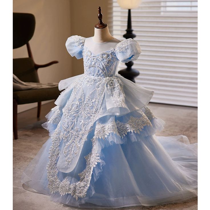 a blue dress is on display in a room