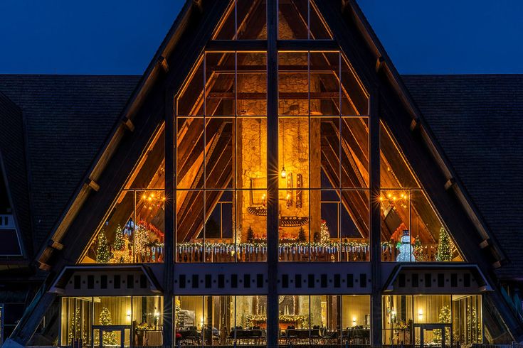 a very large house that is lit up at night