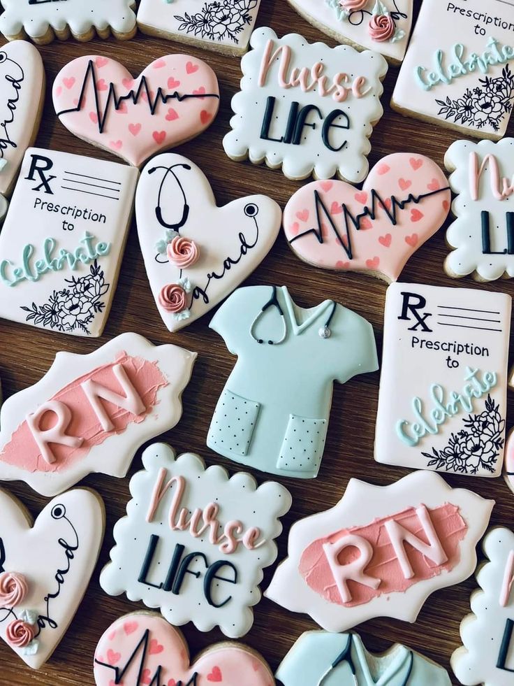 decorated cookies are arranged on a table for someone's birth day party or baby shower