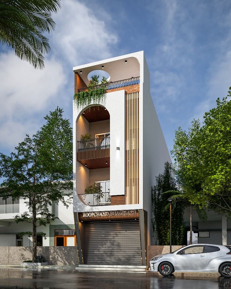 a white building with a car parked in front of it