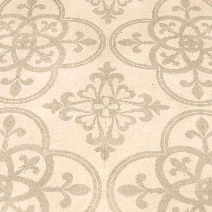 a white and gray wallpaper with an ornate design on it's surface,