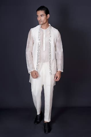 Ivory bundi jacket embroidered with a border of mirror work. Comes with an organza inner kurta with bordered sleeves and coordinating solid pant. - Aza Fashions Luxury White Nehru Jacket For Spring, Fitted White Nehru Jacket With Mirror Work, Festive White Nehru Jacket With Mirror Work, Elegant White Chanderi Nehru Jacket, Designer White Sherwani With Mirror Work, White Chanderi Bandhgala With Cutdana, White Long Sleeve Chanderi Bandhgala, White Sherwani With Mirror Work For Eid, Nehru Jacket With Mirror Work For Diwali Wedding