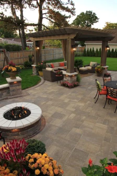 an outdoor patio with seating and fire pit