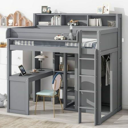 a loft bed with desk underneath it