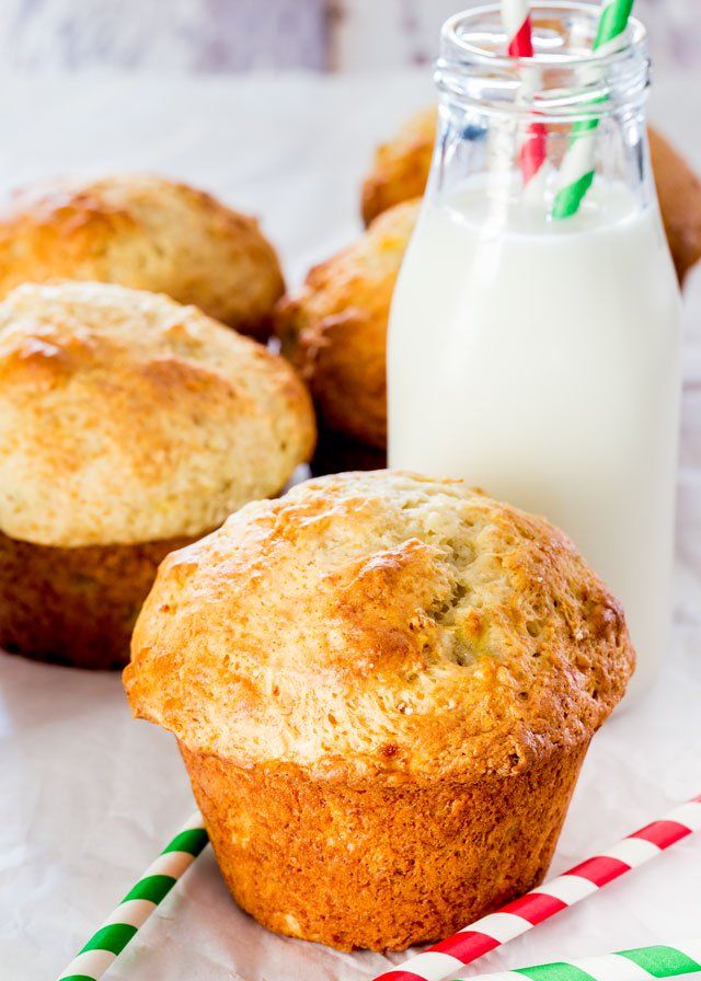 some muffins and a glass of milk on a table