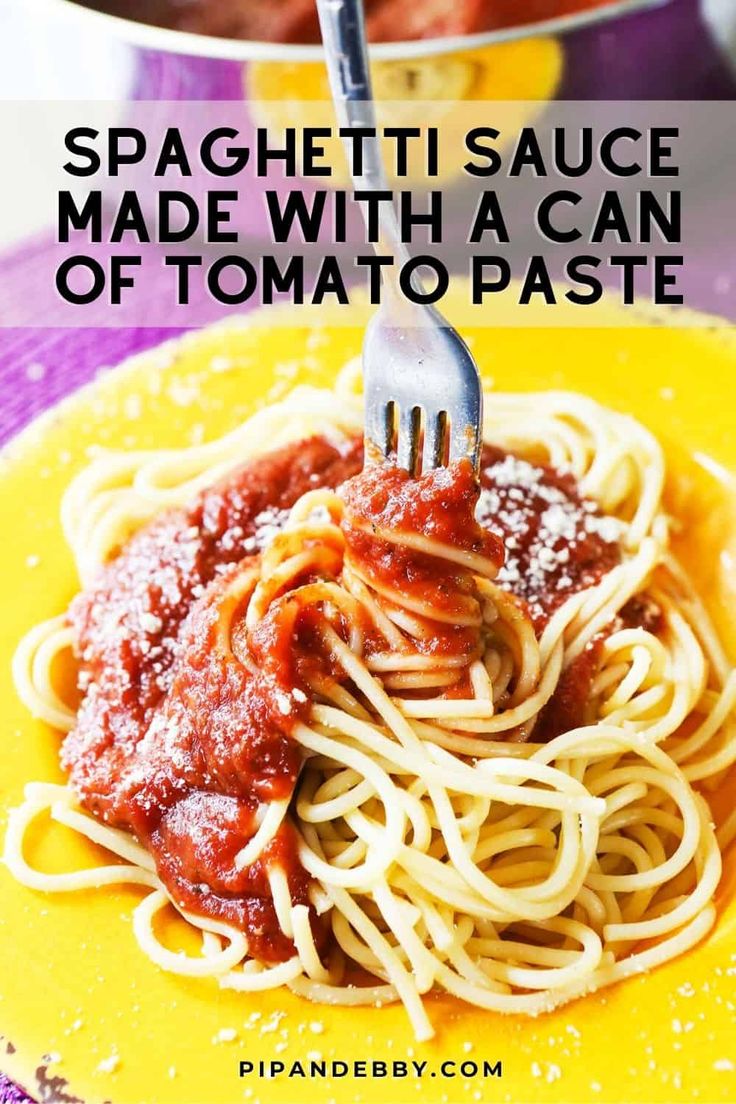 spaghetti sauce made with a can of tomato paste is on a yellow plate and has a fork in it