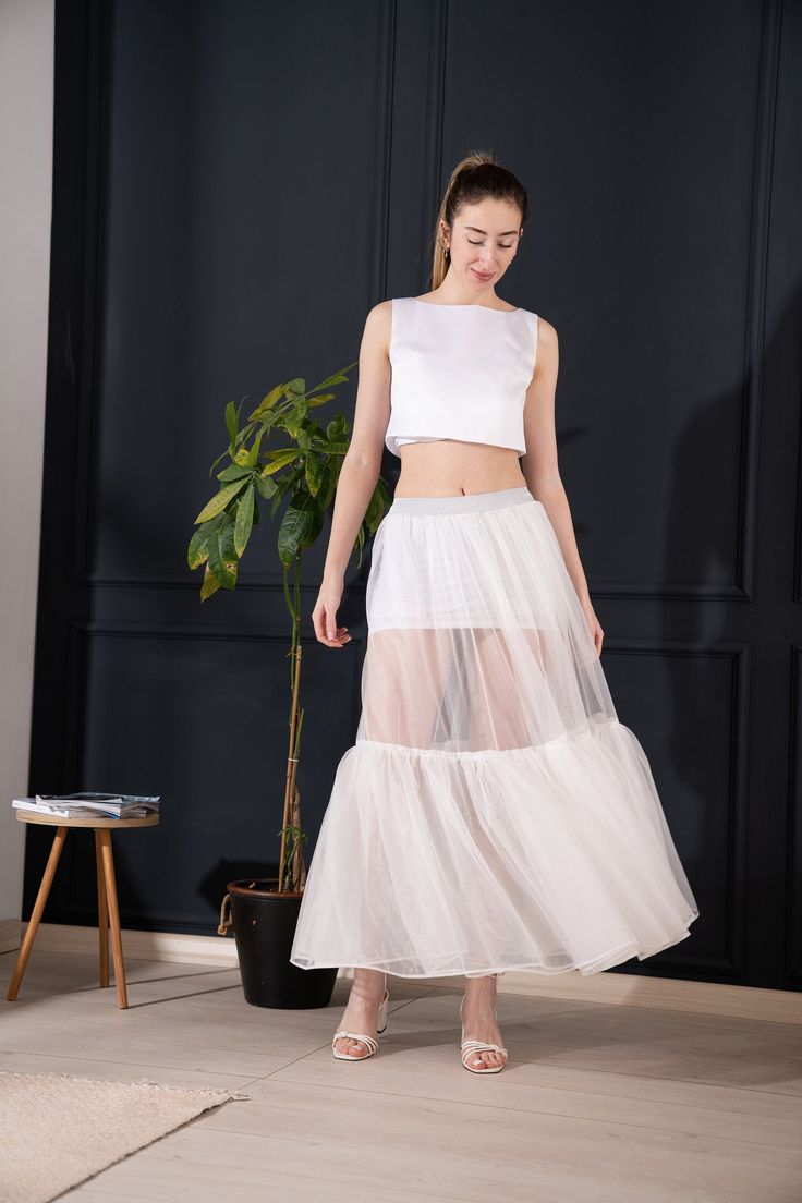 Tulle Skirt ,  Handmade with high-quality tulle fabric for a soft, ethereal feel and graceful movement.Crafted from premium-quality tulle fabric, ensuring durability and a beautiful, flowing drape.Whether you're twirling on the dance floor, strolling through the city streets, or simply want to feel like a princess for a day, our skirt is sure to make you look and feel beautiful. Care Instructions: Mashine Washable at 30oC If you have any questions or special requests, feel free to contact us. Th White Tulle Skirt, Shiny Dress, Graceful Movement, Shiny Dresses, White Dress Party, White Tulle, Feel Beautiful, Skirt White, Tulle Fabric