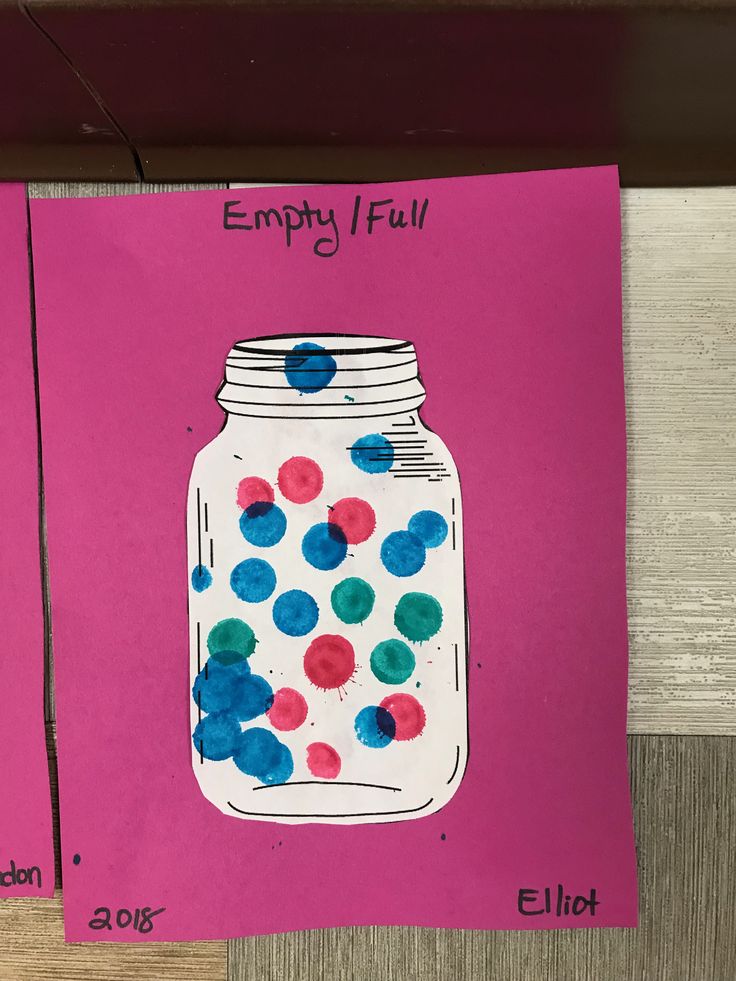 an empty jar is painted on pink paper with blue, red and green polka dots