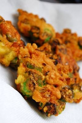 three fried food items sitting on top of a white napkin