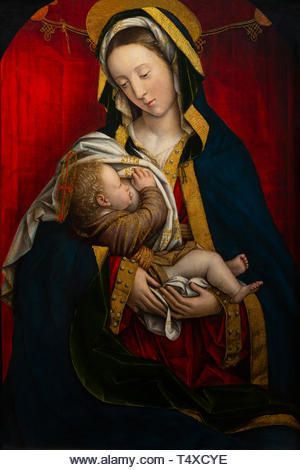 the virgin mary holding a child in her arms