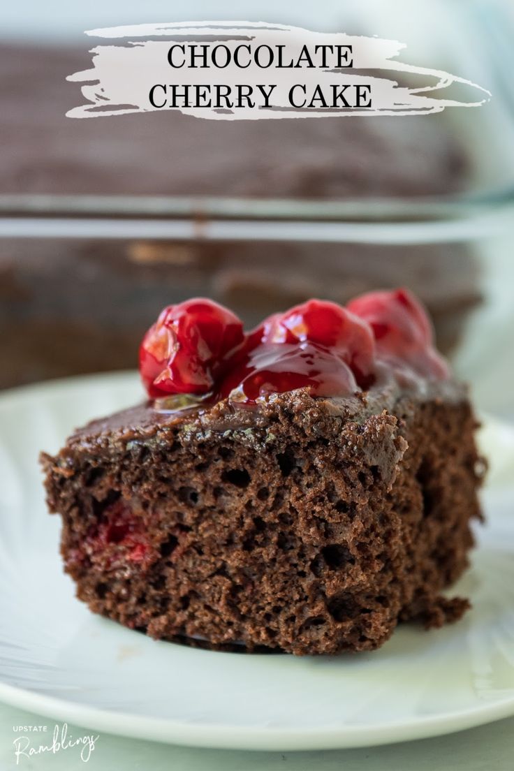 a piece of chocolate cherry cake on a plate