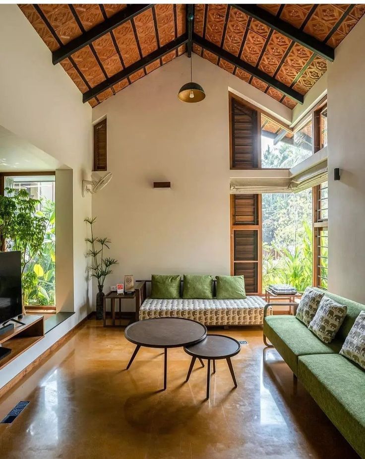 a living room filled with furniture and a flat screen tv