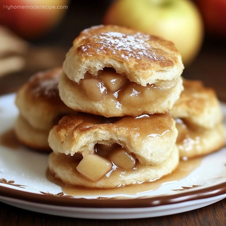 three pieces of apple pie on a plate with caramel sauce and apples in the background