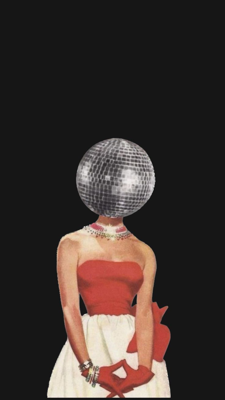 a woman with a disco ball on her head and red gloves is standing in front of a black background