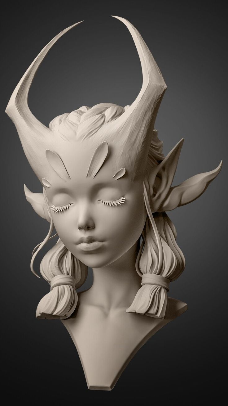 a sculpture of a woman with horns on her head