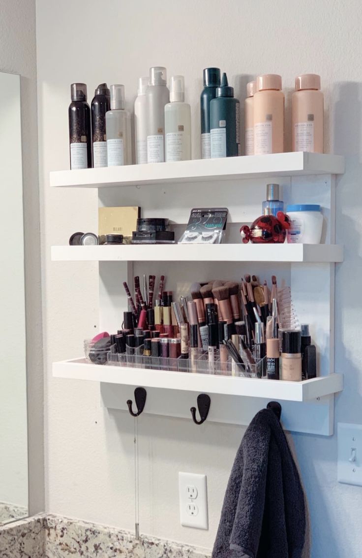 a bathroom shelf filled with lots of beauty products