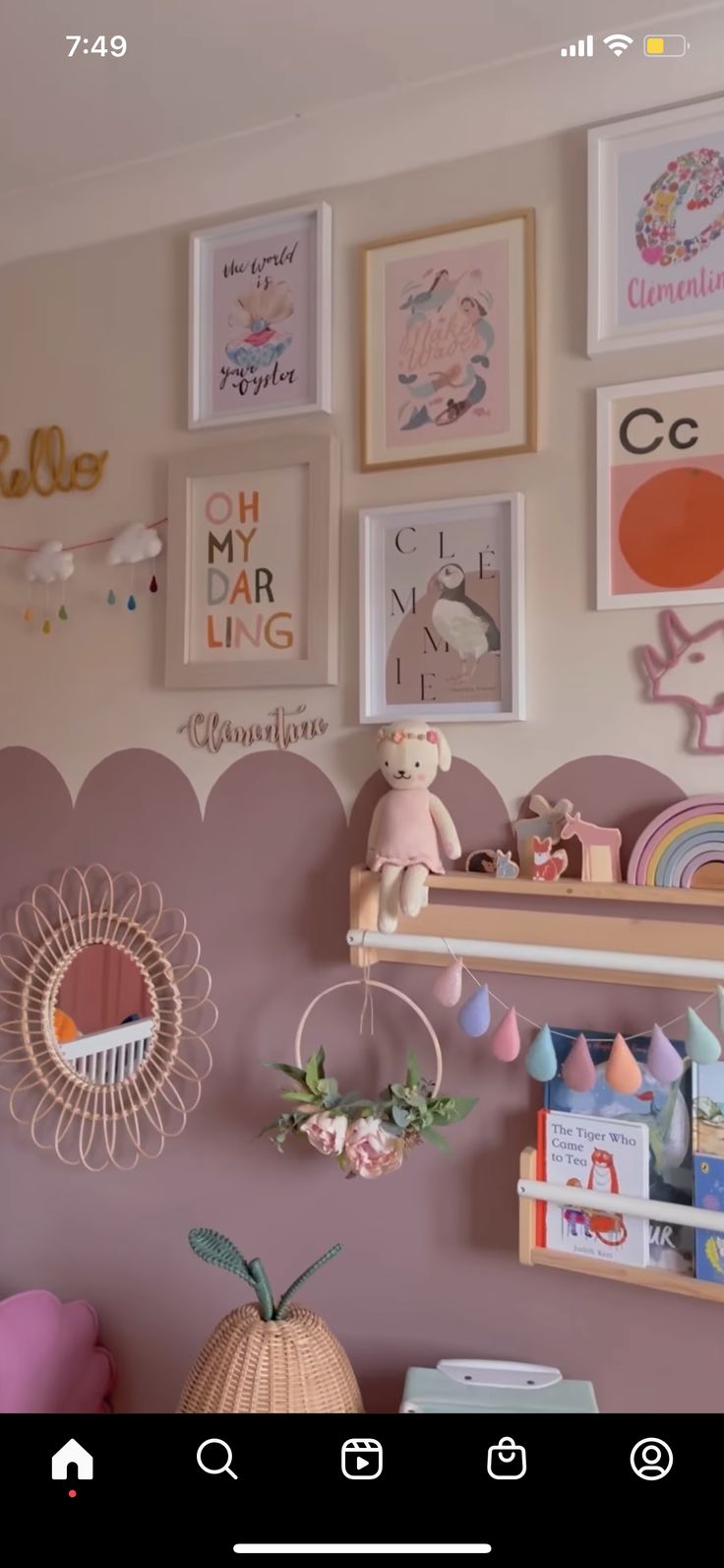 there are many pictures on the wall in this child's room