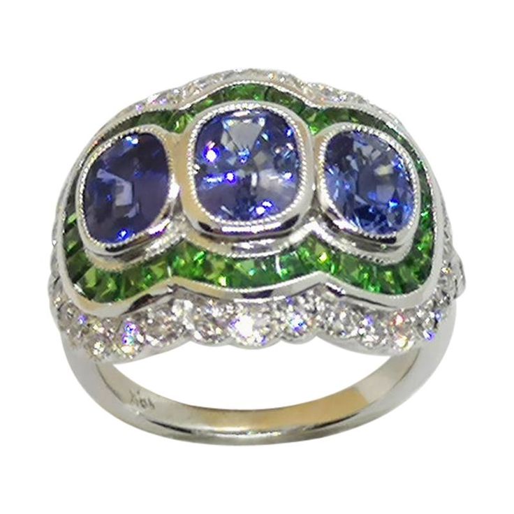 Blue Sapphire 3.21 carats with Tsavorite 1.69 carats and Diamond 0.68 carat Ring set in 18 Karat White Gold Settings Width: 2.0 cm Length: 1.8 cm Ring Size: 53 "Since we first opened doors in 1980 our store was then situated in the vicinity of the Victory Monument; a small and modest storefront with a couple of counters. From our humble beginnings to where we stand today, we has proven our abilities as a jeweler. From the 80s up til today, we have been supplying fine quality pieces to dealers, w Elegant Dressing, Diamond Ring Set, Diamond Ring Settings, Pretty Rings, Deco Style, Jewelry Designs, Art Deco Fashion, Ring Set, Ring Sets